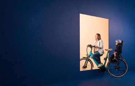 Woman with child on bike