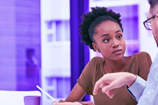 women and men discussing banner