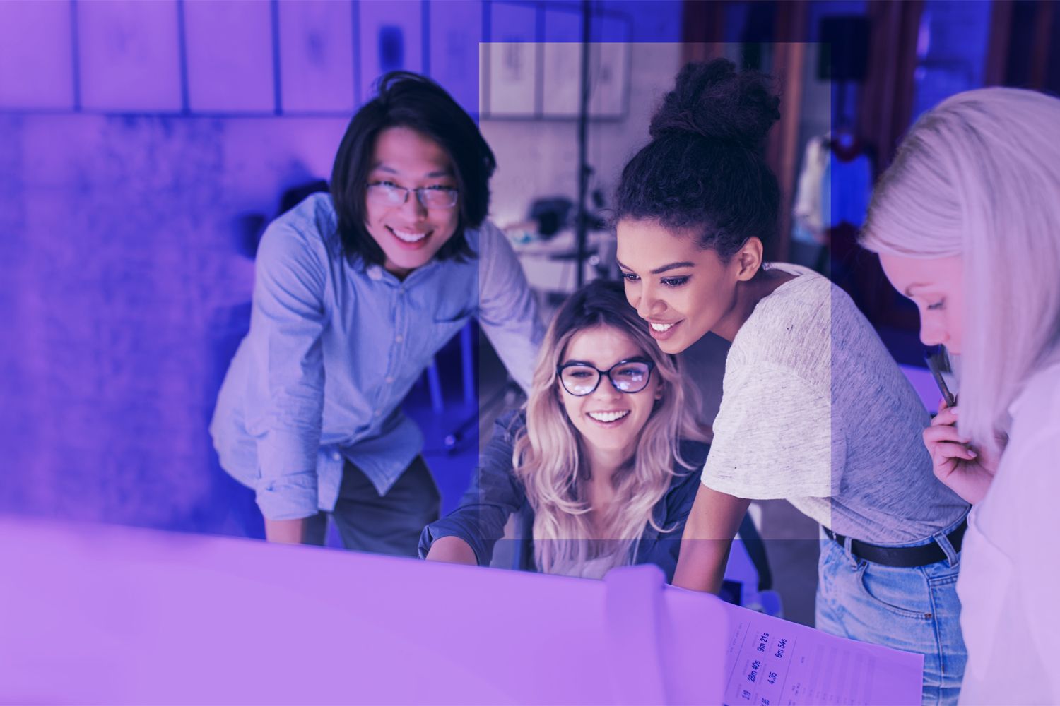 Woman watching something on computer and smiling