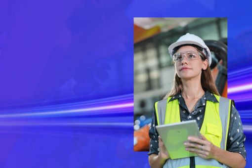 Engineer wearing glasses holding a tab