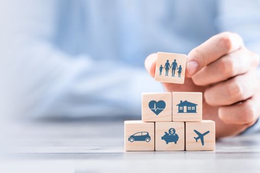 wooden blocks with insurance icons