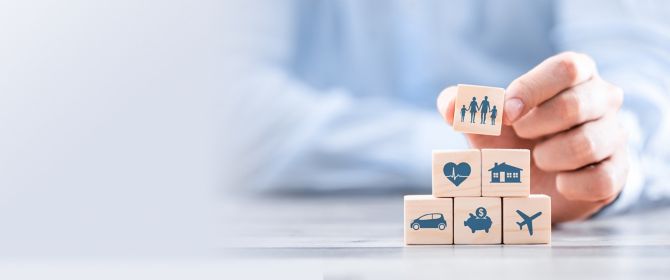 wooden blocks with insurance icons