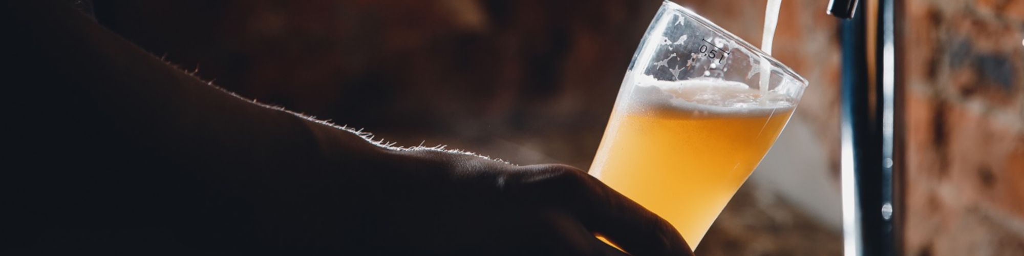 Pouring a beer from a tap