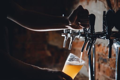 Pouring a beer from a tap