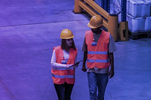 Two employees in the warehouse