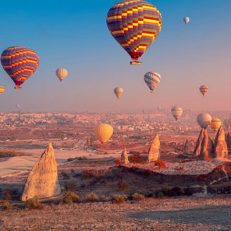 Landscape sunrise in Cappadocia with set colorful hot air balloon fly in sky with sunlight. Concept tourist travel Goreme Turkey.