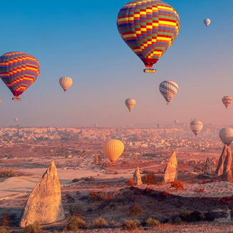 Landscape sunrise in Cappadocia with set colorful hot air balloon fly in sky with sunlight. Concept tourist travel Goreme Turkey.