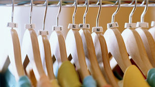 Shirts on hangers in store, close-up