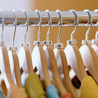 Shirts on hangers in store, close-up