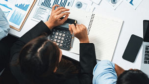 person writing on a paper