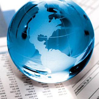 Glass globe on financial papers