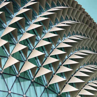 Abstract close-up view of modern aluminum ventilated facade of triangles