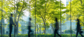 Glass office and working space with blurred people walking fast movement, Eco-friendly featuring sustainable building with green environment and trees, green environment in city
