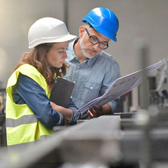 Metal industry manager and engineer meeting in factory