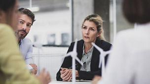 Business executives discussing wind energy