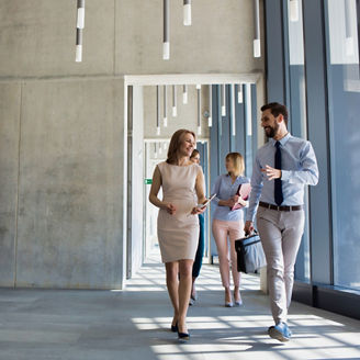 Business people walking in office corridor