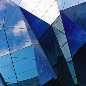Modern building with sky reflection