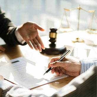 Legal counsel presents to the client a signed contract with gavel and legal law. justice and lawyer concept