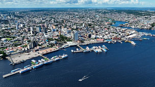 Downtown Manaus Brazil. Capital city of Amazonas State near Amazon river and Amazon forest. Tropical destination. Tropical travel. Tourism landmark.  Outdoors urban scenery downtown Manaus Brazil.