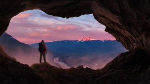 man looking out the horizon, from hiking