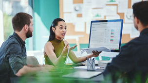 Creative, business people and team discussion with documents in meeting for brand or target audience. Group, campaign manager and planning with chart for ads, performance data or strategy in startup.