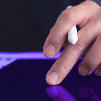 Hand touching an iPad with sheets