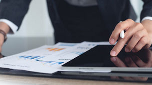 Hand touching an iPad with sheets