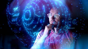 A pensive man looking at a shape with a blue background