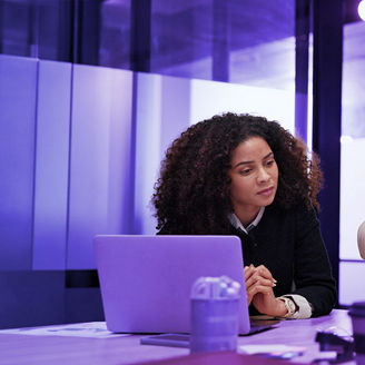 Three colleague are discussing in a meeting room