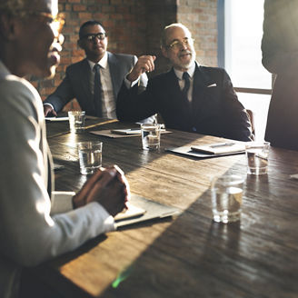 Businessmen at boardroom table