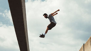 Man jumping over building