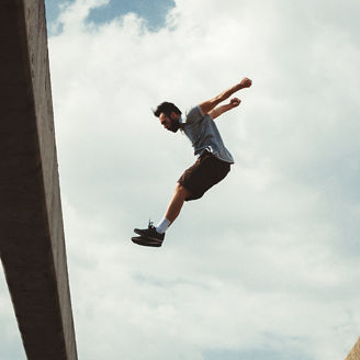 Man jumping over building