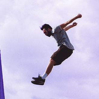 Man in comfortable clothes doing parkour