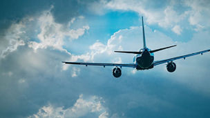 Airplane flying through clouds