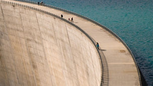 Wall of a dam holding up water
