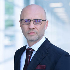 Blurred abstract background interior view looking out toward to empty office lobby and entrance doors and glass curtain wall with frame
