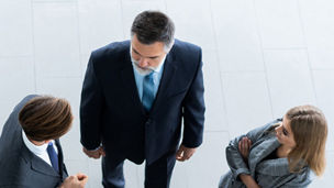 Business people talking in a circle