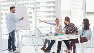 Man presenting something to a team