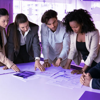 People standing around a desk and working