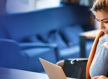 Woman with laptop and credit card
