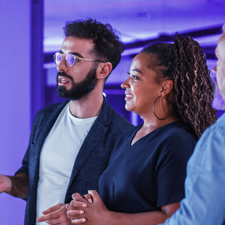 CFOs interacting in front of data screen