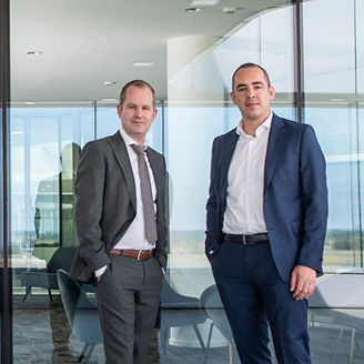 Two KPMG experts, Jeroen Trumpener and Paul Dreezen, are looking at the camera.