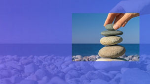 stacking flat stones at beach