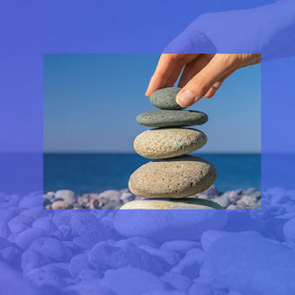 stacking flat stones at beach