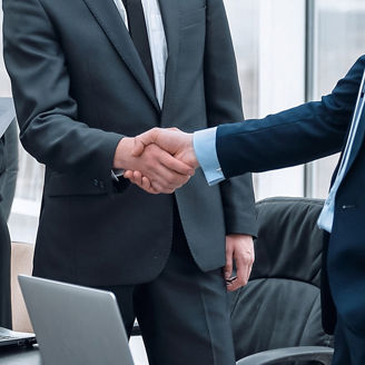 A photo of two men shaking hands