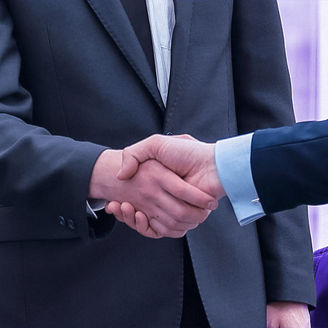 A photo of two men shaking hands