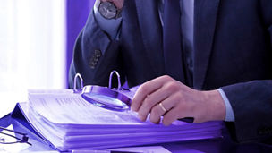 Paper and a magnifying glass