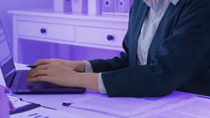 person writing on a paper