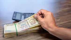 A person counting cash