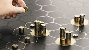 Stacks of coins on a dark background.